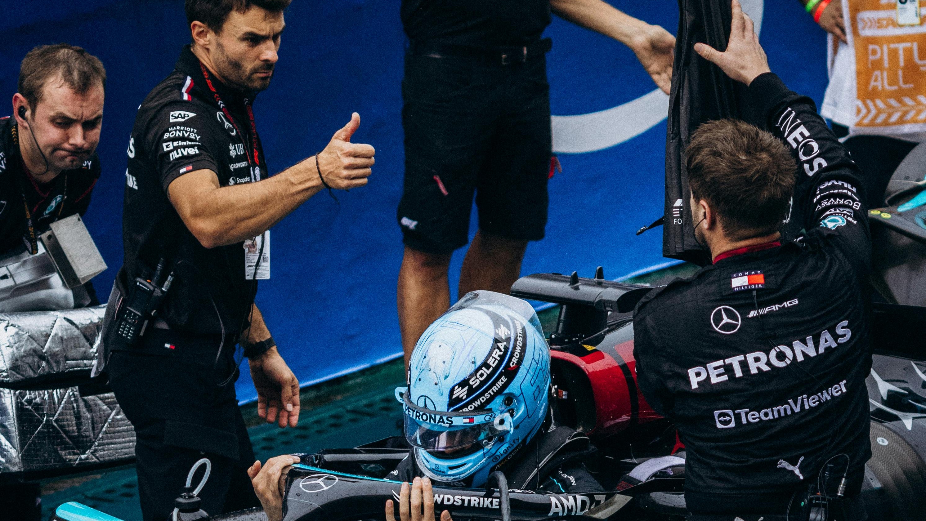 Mercedes-AMG Petronas F1 Pit Crew Giving Thumbs Up to Driver in Car