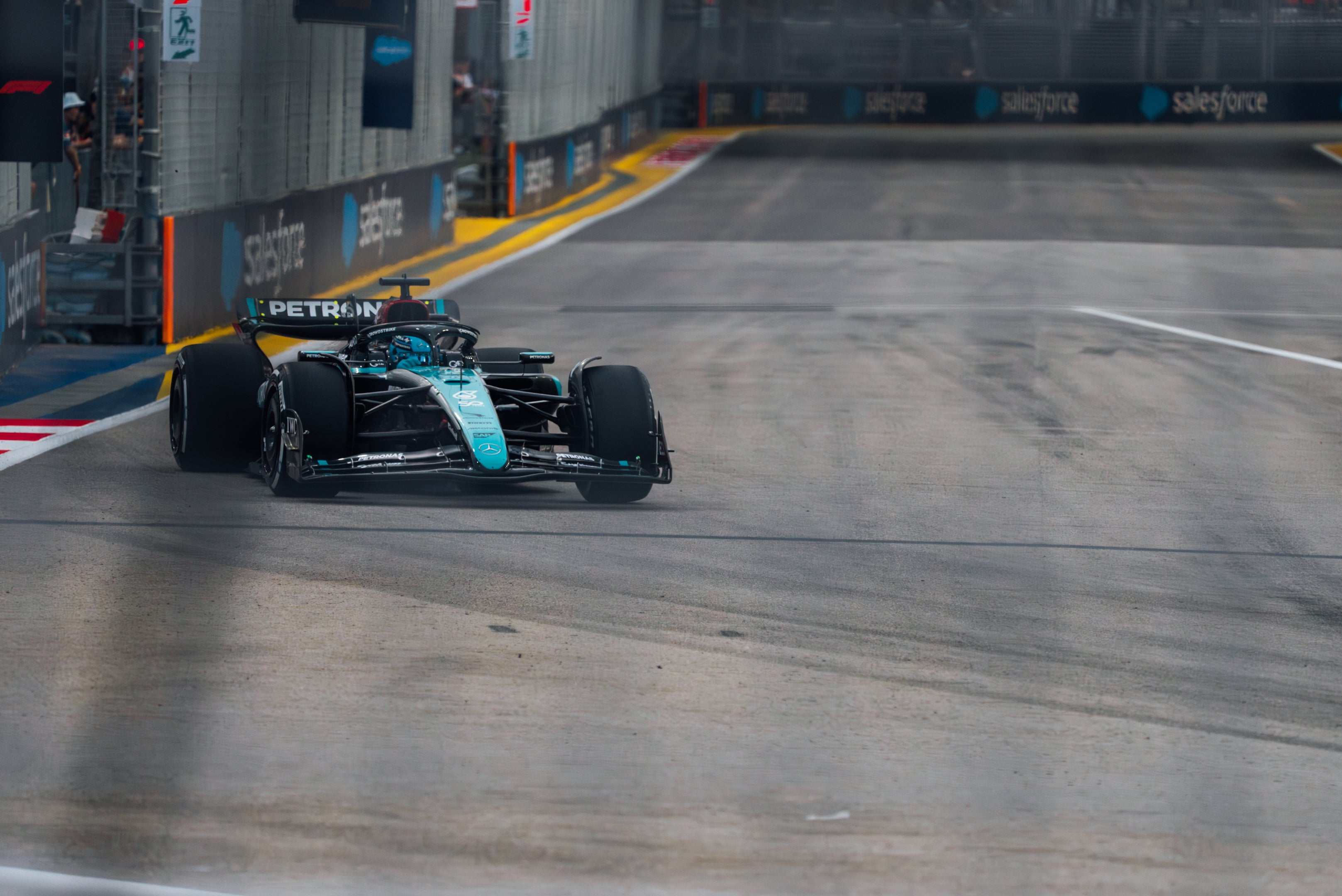 Formula 1 car on a racetrack with 'Petronas' branding