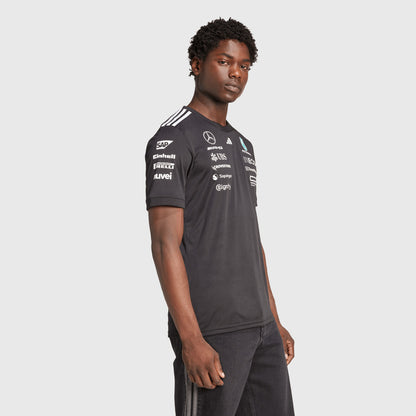  Side profile of model wearing 2025 Mercedes-AMG driver shirt